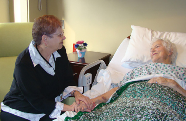 Volunteer visiting a patient